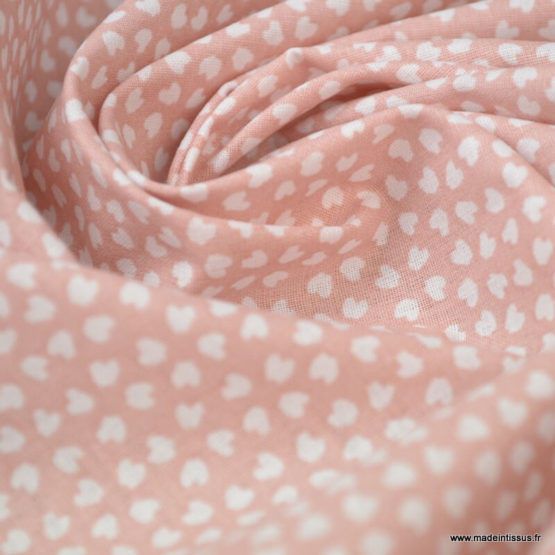 Feuilles blanches fond rose